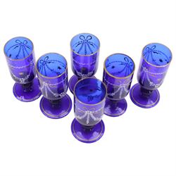 19th century style blue glass decanter and six drinking glasses, the decanter of mallet form with lozenge shaped stopper, all with white enamel and gilt swag decoration, decanter H34cm, drinking glasses H11.5cm