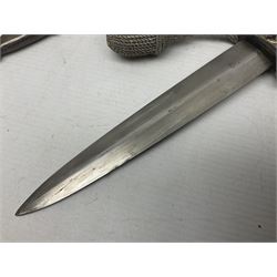 German Paul Weyersberg & Co Solingen DLV flyers dagger with 18cm steel blade, plated brass/tombac downswept cross-piece and pommel and leather covered grip, in leather and plated brass/tombac scabbard with leather hanger strap and silvered knot L35cm overall. Auctioneer's Note: After WWI Germany was forbidden an air force by the Treaty of Versailles however the Deutscher Luftsport-Verband (German Air-sport Association) was formed in March 1933 from various sports flying clubs and had branches for aeroplane, gliding and balloon flying. Under cover of the sporting DLV, many future Luftwaffe pilots trained to fly. DLV was embodied with the NSKK in March 1935 and on 1st March 1937 Luftwaffe was formed.