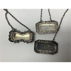 Silver plated tray, with shaped rim and embossed with a dog and crown to centre, stamped Valenti, together with three silver plated decanter labels, two port and one Bucellas, a plated cream jug with embossed floral decoration and a pair of plated fish knives engraved with double headed eagle to handle, tray W25.5