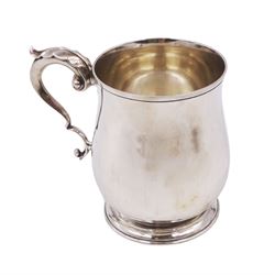 1920s silver christening mug, of plain waisted form with acanthus capped C scroll handle, upon circular stepped foot, hallmarked J B Chatterley & Sons Ltd, Birmingham 1920, H9.5cm