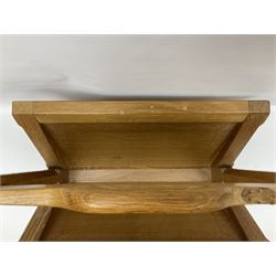 Mouseman - oak magazine rack, the top rail pierced with handle and carved with mouse signature, octagonal supports with two panelled and splayed sides, on sledge feet, by the workshop of Robert Thompson, Kilburn 