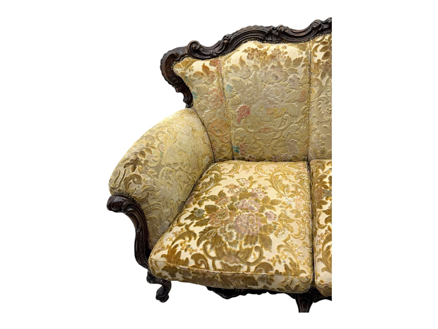 Victorian design stained wood three seater settee, top rail carved and scrolled, padded back and arms, scrolled cabriole feet 