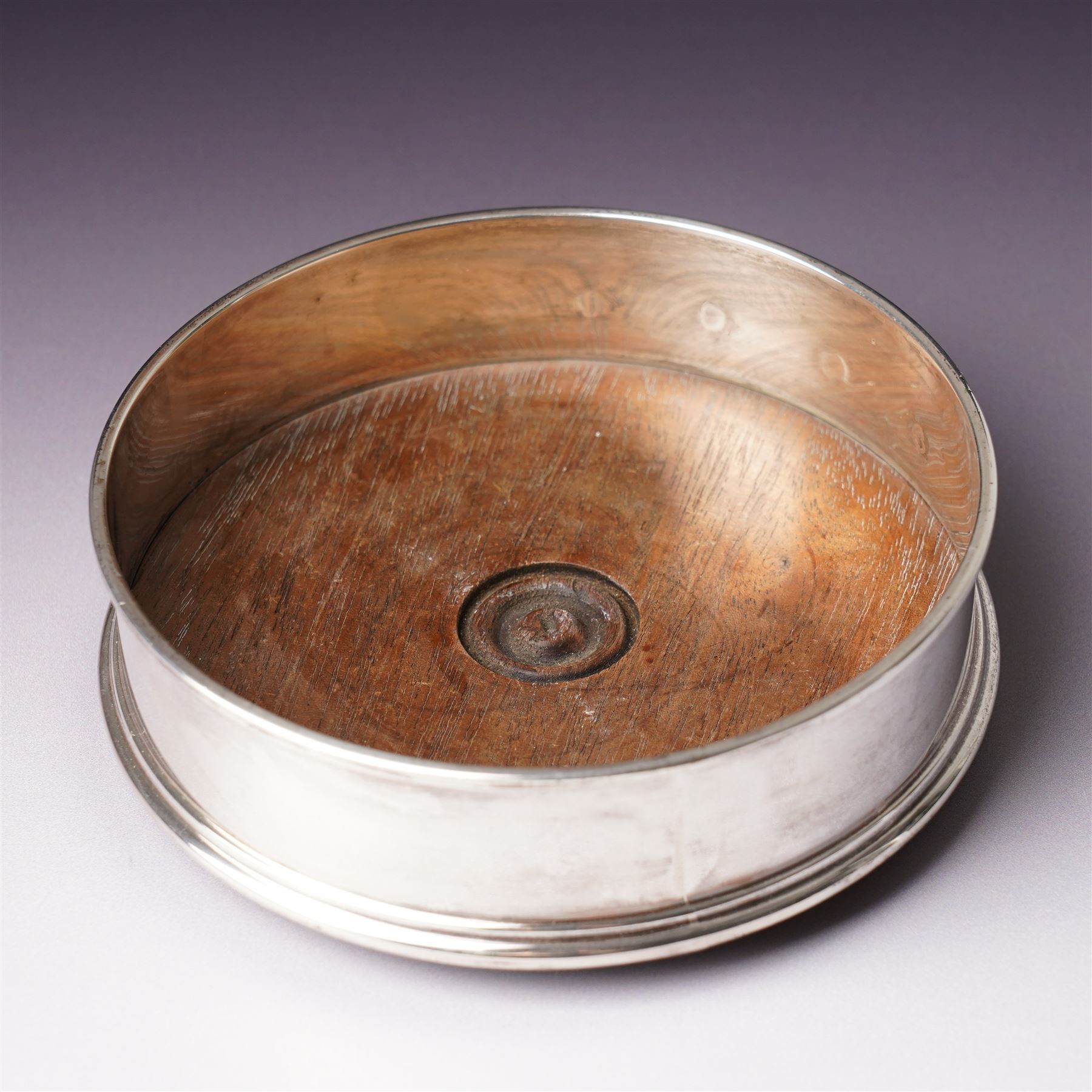 German 925 standard silver cigarette box with hinged lid  and a silver bottle coaster with turned wood base London 1986 Maker M C Hersey & Son