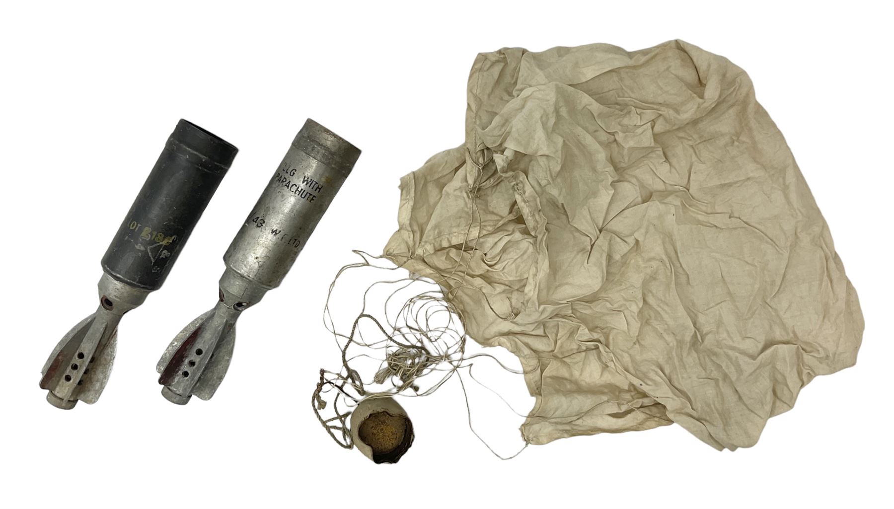 Two inert WW2 parachute flare casings, one with parachute and dated 5/43 L24cm (3)
