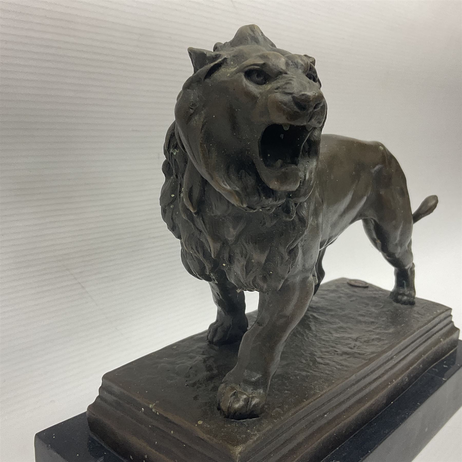 After Charles Valton, bronze, modelled as a lion, upon bronze plinth signed C H Valton, with foundry seal for J B Deposee, and black marble plinth base, overall H20cm L26cm