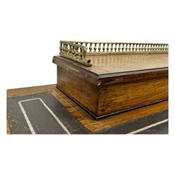 Late Victorian walnut writing table, rectangular leather-inset top surmounted by a brass gallery, fitted with a single frieze drawer, raised on turned tapering supports with lower undertier and ceramic castors