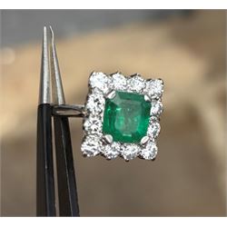 18ct white and yellow gold emerald and diamond cluster ring, single octagonal cut emerald of approx 1.55 carat, surrounded by twelve round brilliant cut diamonds, total diamond weight approx 0.95 carat