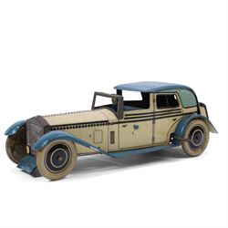 Wells tinplate clockwork limousine, the cream body, with blue roof and lithographed detail...