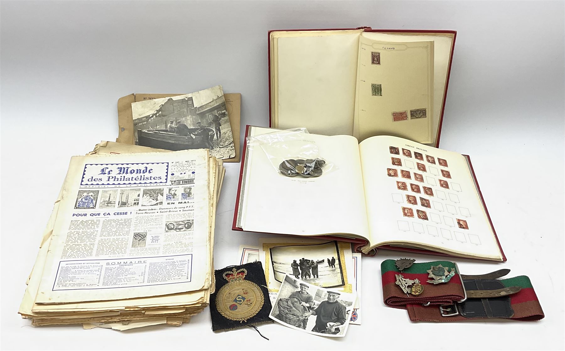 Great British and World stamps in two albums including a small number of Queen Victoria penny red stamps, small number of coins and various items of militaria interest