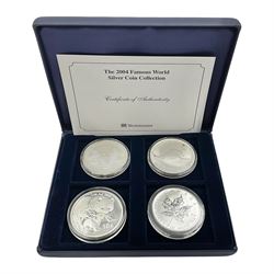 Four one ounce fine silver coins, forming 'The 2004 Famous World Silver Coin Collection', comprising United States eagle, Australian kangaroo, Chinese panda and Canadian maple leaf, cased with Westminster certificate 