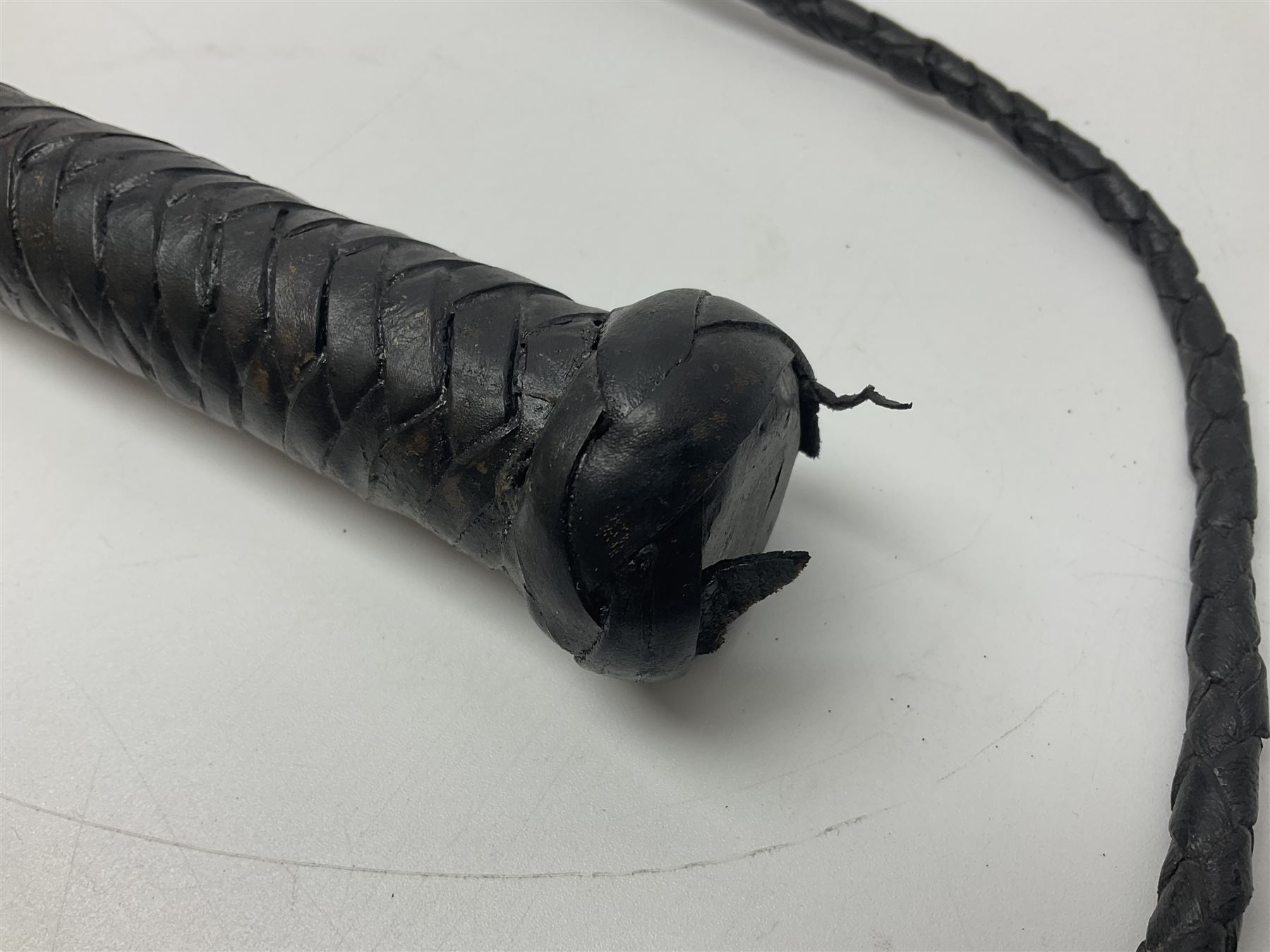 Near pair of short swords each with slightly curving 41cm fullered steel blade and all brass H-shaped hilt L52cm overall; plaited black leather whip; and reproduction pair of brass hilted swords, brass halberd blade and mace (7)