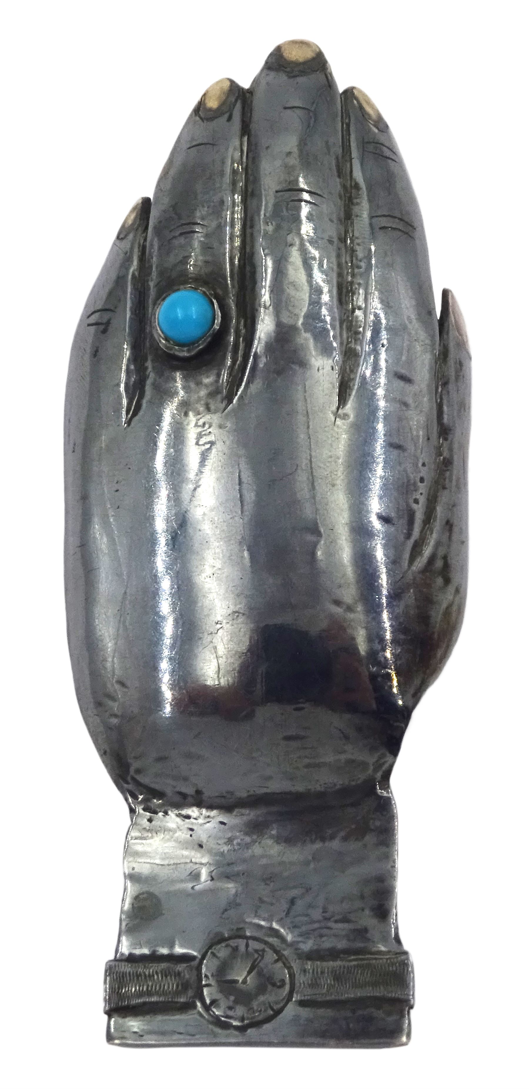 Modern Guild of Hull Silversmiths oxidised silver caddy spoon, modelled as an outstretched hand with engraved wristwatch to wrist and inset turquoise cabochon to finger, hallmarked Charles Richard Berkin of Beverley, London 1987, also marked with the three crowns mark of the Guild of Hull Silversmiths, L 8.7cm, approximate weight 0.89 ozt (27.9 grams)

Abraham Barachin was the last Hull silversmith to use the Hull mark of three ducal coronets in around 1706. 
However in 1983 the Assay Offices of Great Britain and the City of Kingston upon Hull granted the Guild of Hull Silversmiths permission to use the City's Coat of Arms as an additional mark on pieces they produced. 