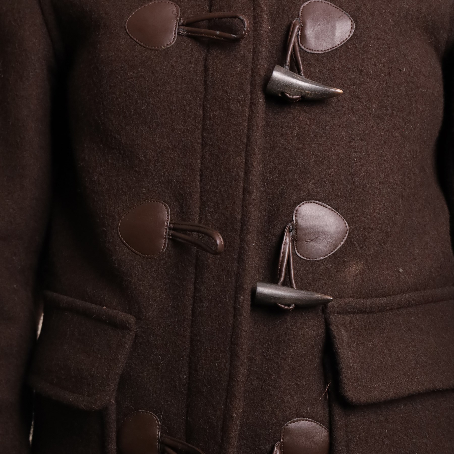 Barbour and Aquascutum - three ladies’ coats, comprising a Barbour Classic Duffle in dark brown wool blend with toggle fastenings and signature tartan lining, size UK 8, together with two Aquascutum herringbone wool coats, each double-breasted and fully lined, both bearing Regent Street London labels (3)