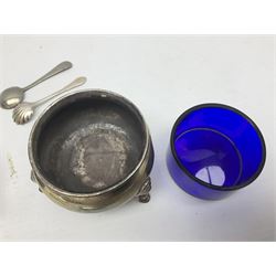Pair of early 20th century silver open salts, of cauldron form, each with blue glass liner, silver teaspoon, and silver salt spoon with shell bowl, etc., approximate total silver weight 106.5 grams
