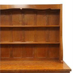 Cat and Mouseman - adzed oak dresser and plate rack, plate rack with two delf rack, panelled back and shaped uprights, above a base with two short drawers and turned wooden handles, panelled cupboard doors and sides, raised on a plinth base, with carved Cat and Mouseman signature, by Lyndon Hammell of Harmby