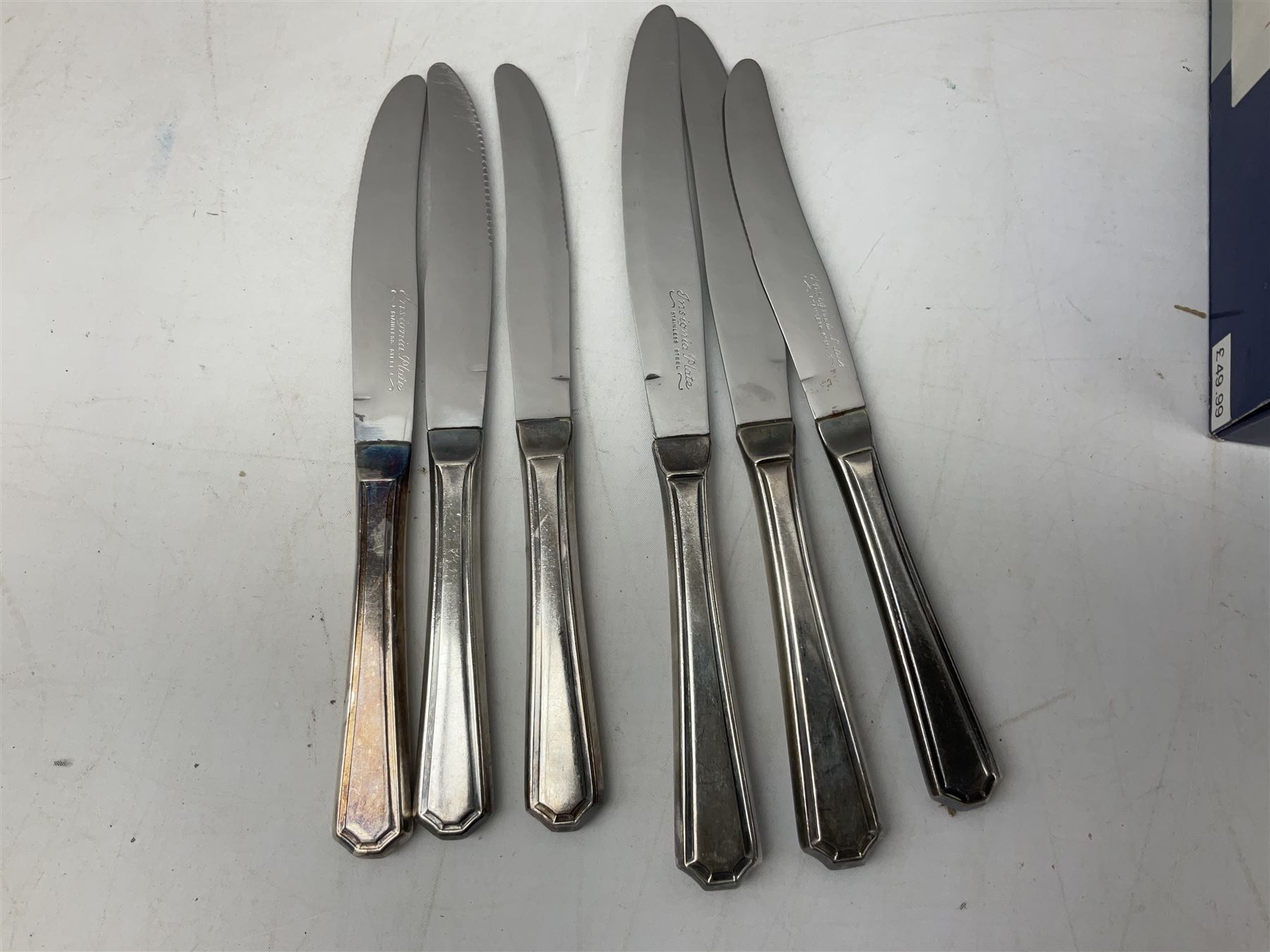 Four butter knives with hallmarked silver handles together with a Quantity of silver-plated cutlery stamped Ashberry and other stainless steel cutlery