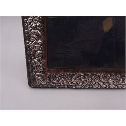 Modern silver mounted picture frame, of rectangular form, embossed with C scrolls and flowers, with easel style support verso, hallmarked Keyford Frames Ltd, Birmingham 1993,  H14.8cm, 