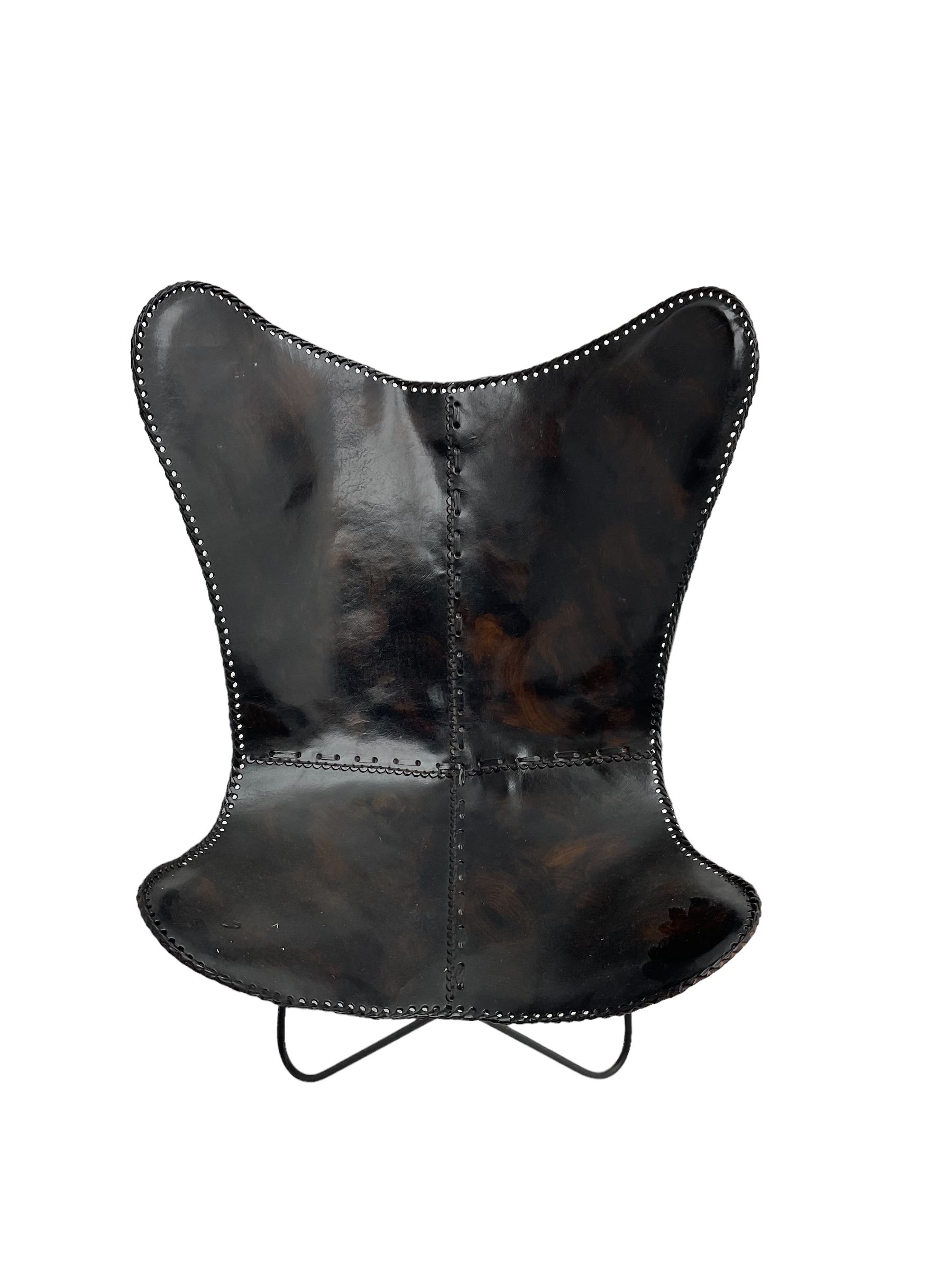 Butterfly Chair, black finish metal frame with stitched slung leather cover