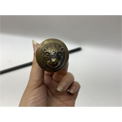 
Late 19th/early 20th century Anglo Indian ebony and bone sword stick with 62cm steel blade, brass locking ferrule and lion mask pommel L92 cm.