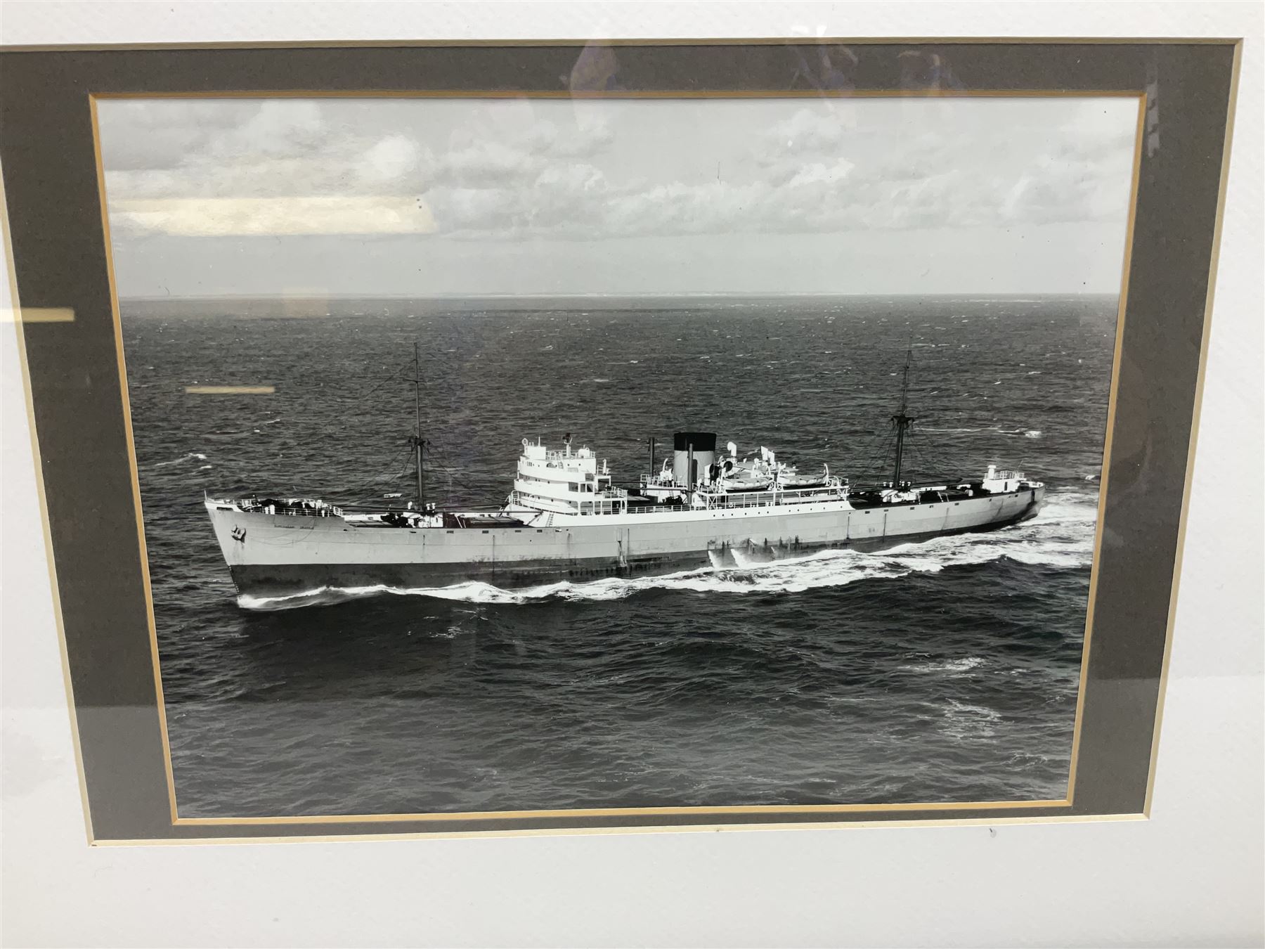 Set of twelve monochrome photographs of mid-20th century merchant vessels comprising general cargo ships, cargo liners, RMMV passenger cargo liners and hospital ship including Rowallan Castle, Drakensberg Castle, Stirling Castle, Capetown Castle, Pachumba, Tilapa etc; average size 18 x 24cm; uniformly mounted in black frames (12)