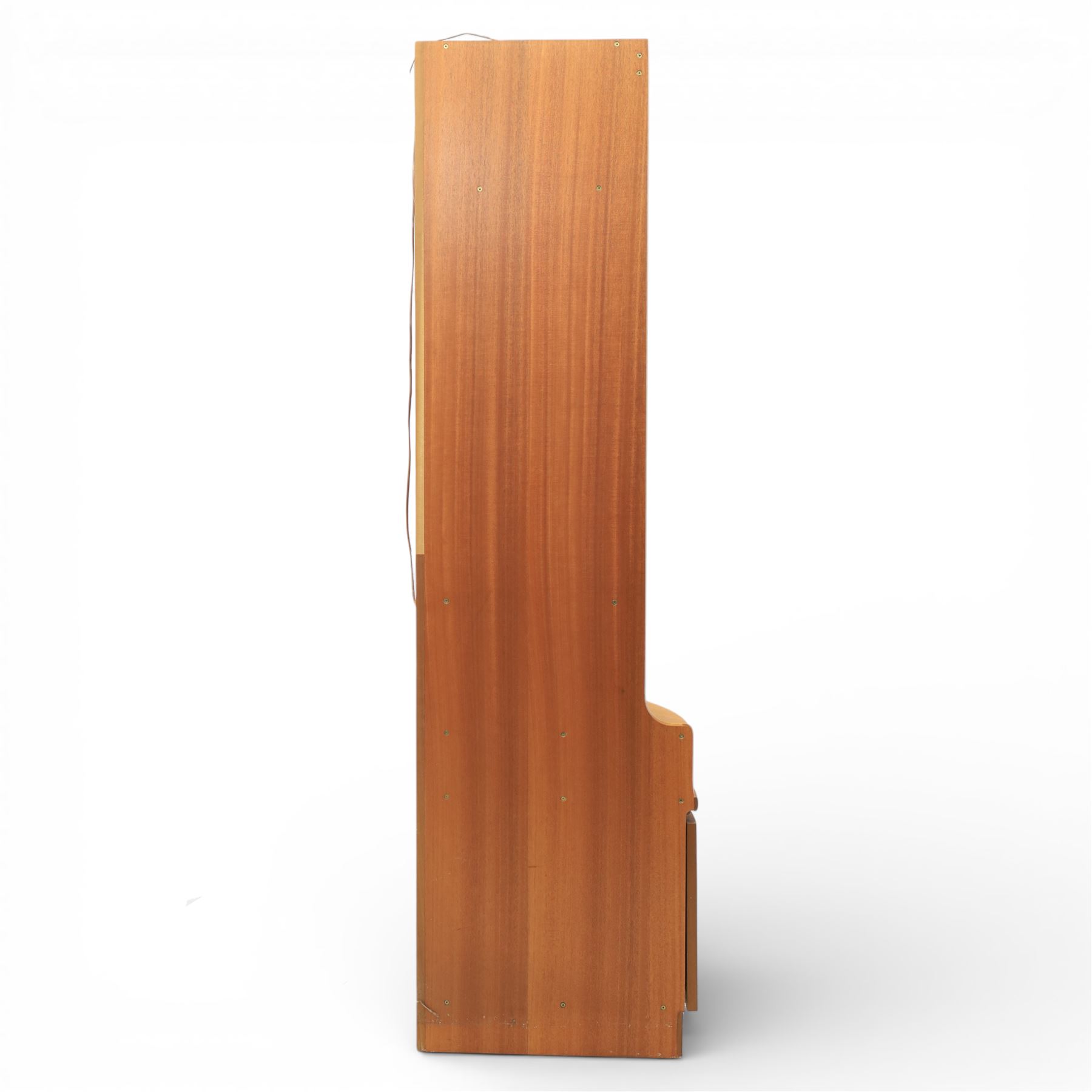 Nathan - 'Squares' corner cabinet, the upper section enclosed by two curved glazed doors with glass shelves, over a shaped base fitted with a single frieze drawer and panelled twin cupboard doors