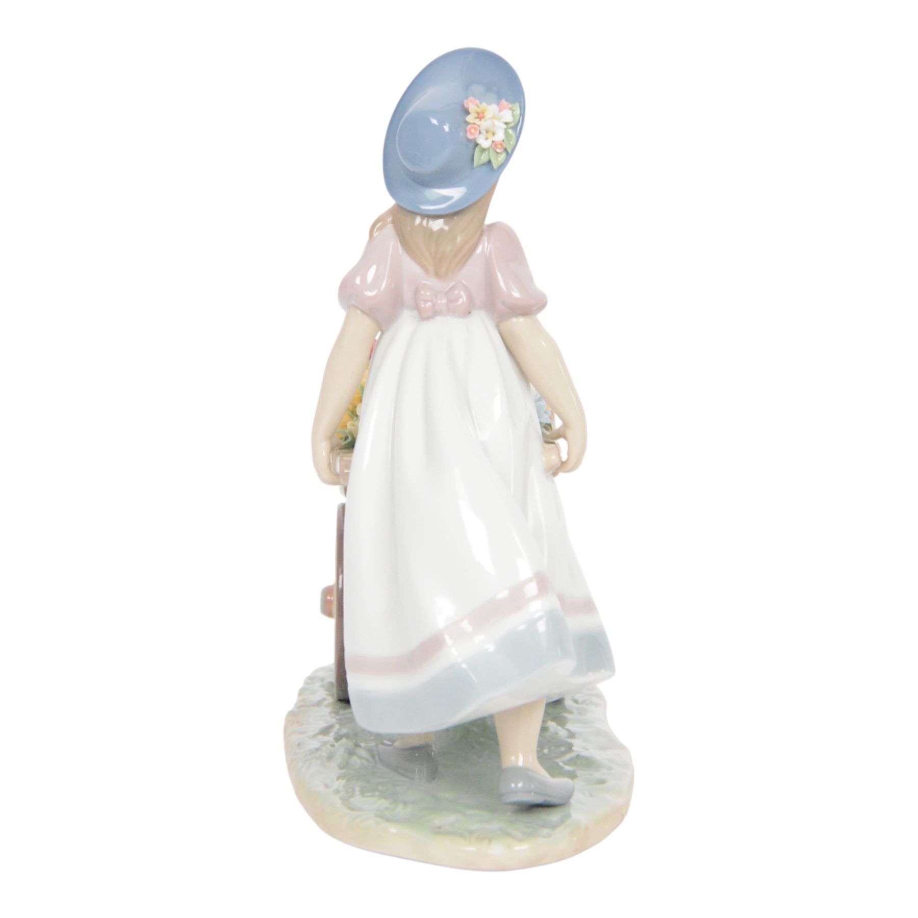 Lladro, Love's tender tokens girl, with floral filled wheelbarrow, model 6521, H23cm