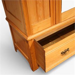 Edwardian ash single wardrobe, the moulded cornice above a single mirrored  hanging interior, flanked by panelled sections with drawer below, raised on bracket feet