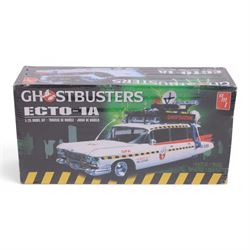 Neca Back to the Future Marty Mcfly figure, AMT Ghostbusters Ecto-1A 1:25 scale model kit and Vinyl Idolz Egon Spengler figure, all boxed