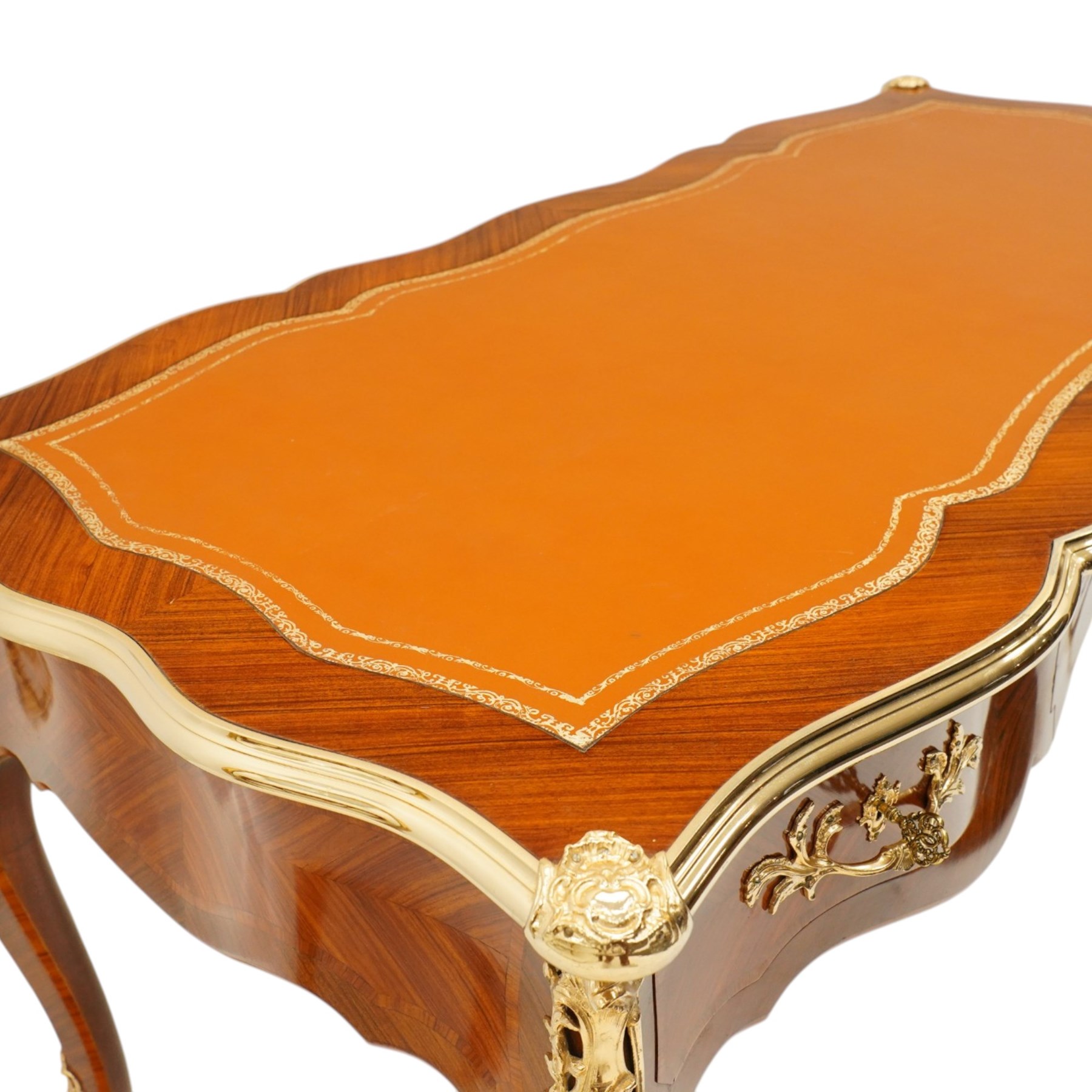 Baggio Anciens Meubles - Italian Louis XV style kingwood and gilt metal mounted bureau plat or writing desk, the shaped rectangular top with inset leather writing surface with gilt metal edge, above three shaped frieze drawers with gilt metal handles, raised on cabriole supports with gilt cartouche mounts to the knees and scroll feet
