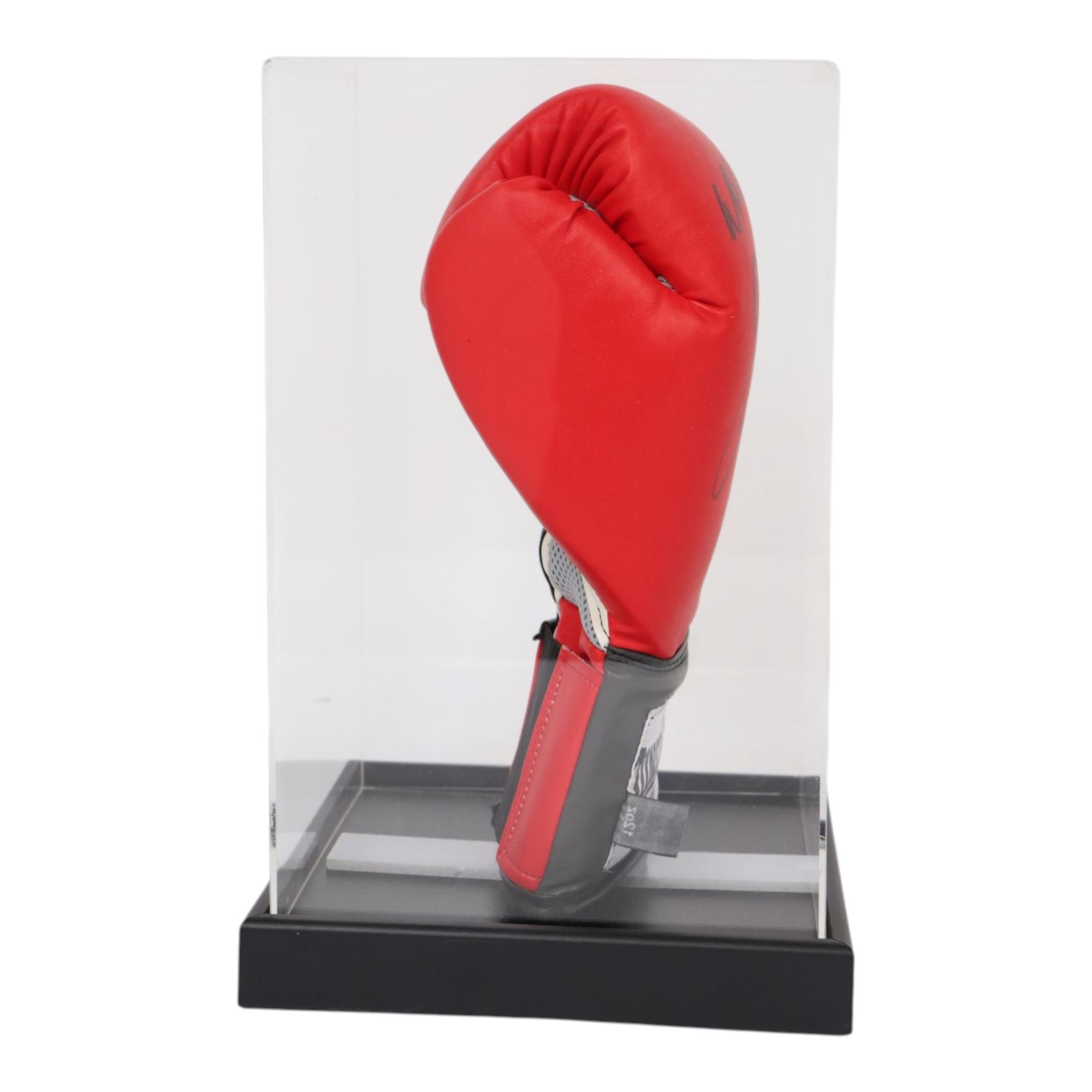 Lonsdale boxing glove, signed by Nigel Benn in black marker pen, in acrylic display box