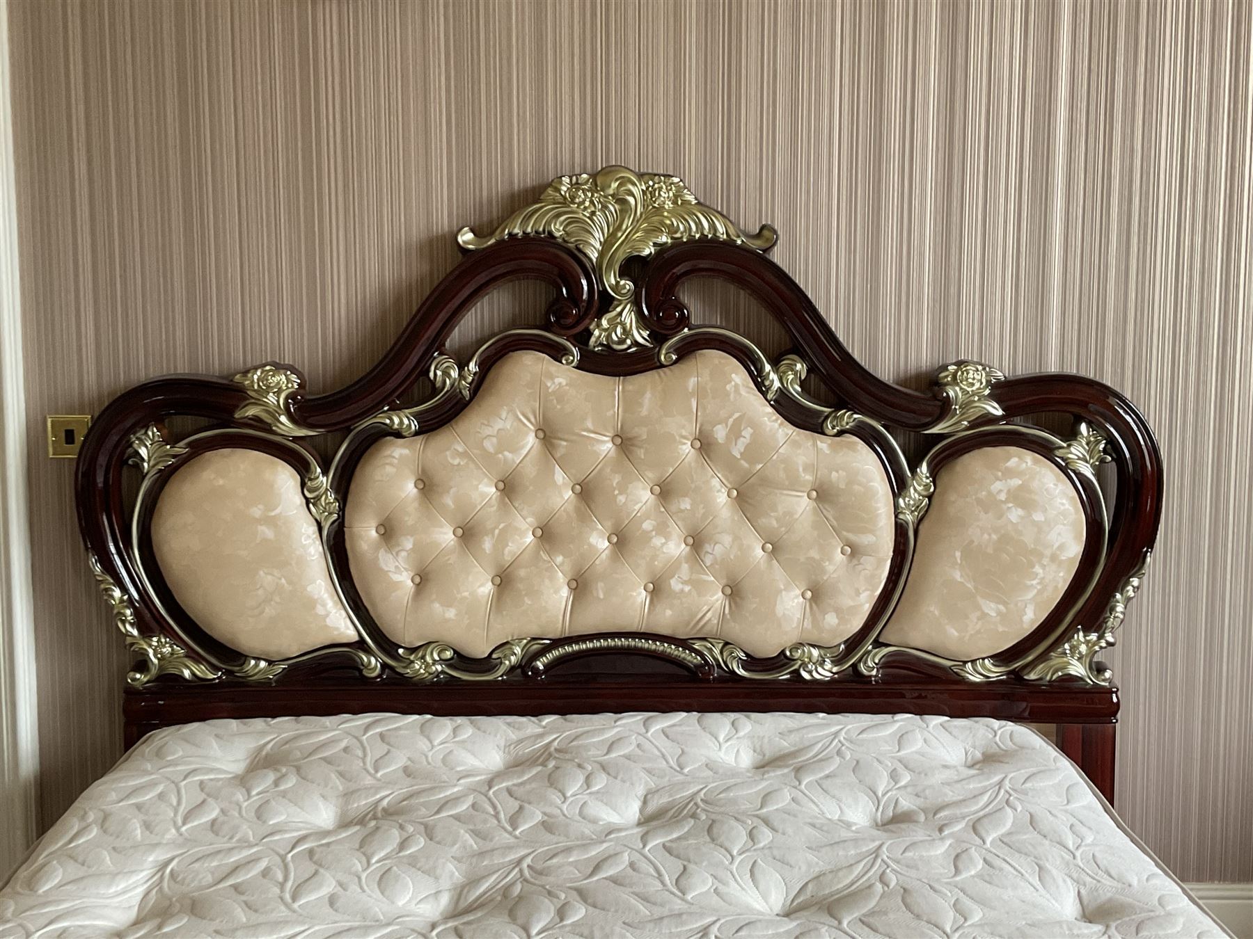 Rococo style 6' Super Kingsize bed, ornate shaped and floral design in wood finish, upholstered buttoned headboard, decorated with scrolled foliate and flower heads, together with mattress