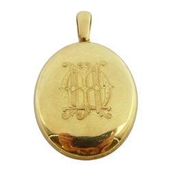  18ct gold oval hinged locket pendant, e