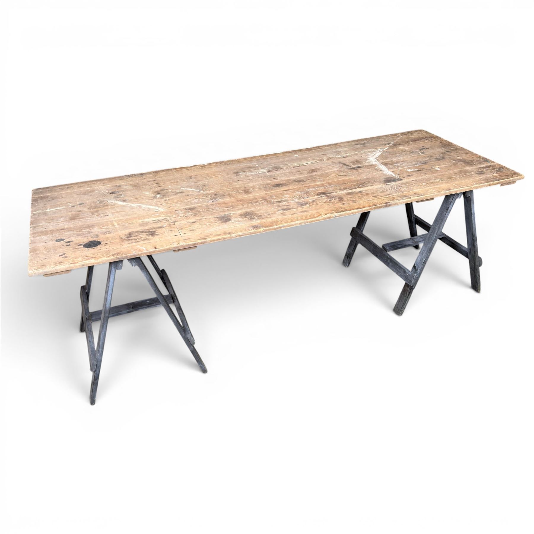 Vintage wooden plank trestle table, on two painted folding stands