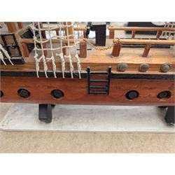 Wooden model ship 'Mayflower', together with a similar smaller example, largest H56cm