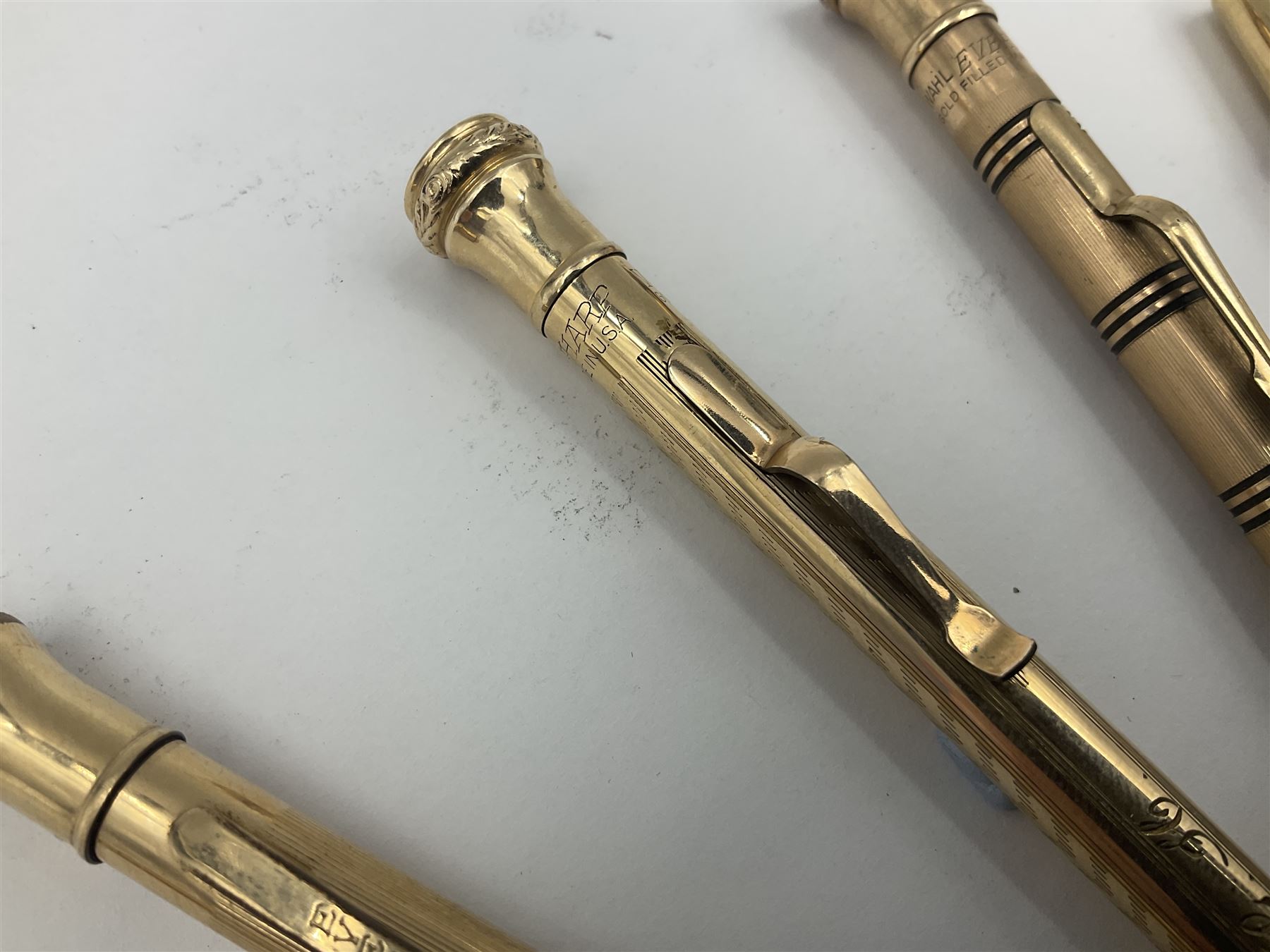 Five gold filled Wahl Eversharp propelling pencils, together with a silver propelling pencil, hallmarked London 1946, J.M.Co Johnson, Matthey & Co, and two further gold filled propelling pencils, one with box, largest L13cm (8)