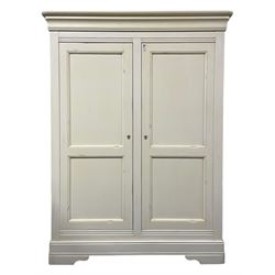 Cream finish double wardrobe, enclosed by two panelled doors, the interior fitted with shelves and hanging rail 