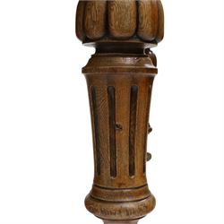 Large Victorian oak extending dining table, the rectangular top with rounded corners and moulded edge, plain frieze over large turned lobed and fluted supports terminating to brass cups and castors, with two additional leaves