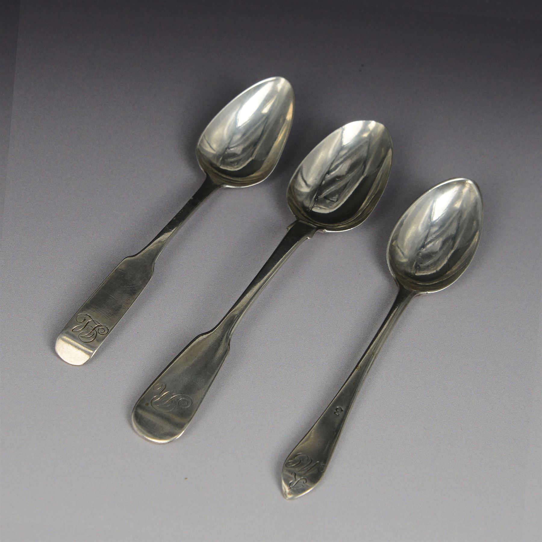 Three Scottish Provincial silver teaspoons, comprising Celtic Point pattern example, probably Alexander Campbell, Greenock, C1790-1800, a Fiddle pattern example, hallmarked Andrew Davidson, Arbroath, C1825-1845 and a Fiddle pattern example, hallmarked Peter Lambert, Montrose, C1833-1838, all engraved with initials