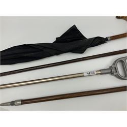 Early 20th century curved horn handle walking stick with hallmarked silver mounts, engraved L Russell 1918, together with a shooting stick by William Mills Birmingham, with leather handle, 'The Featherwaite' shooting stick and an umbrella with wooden handle