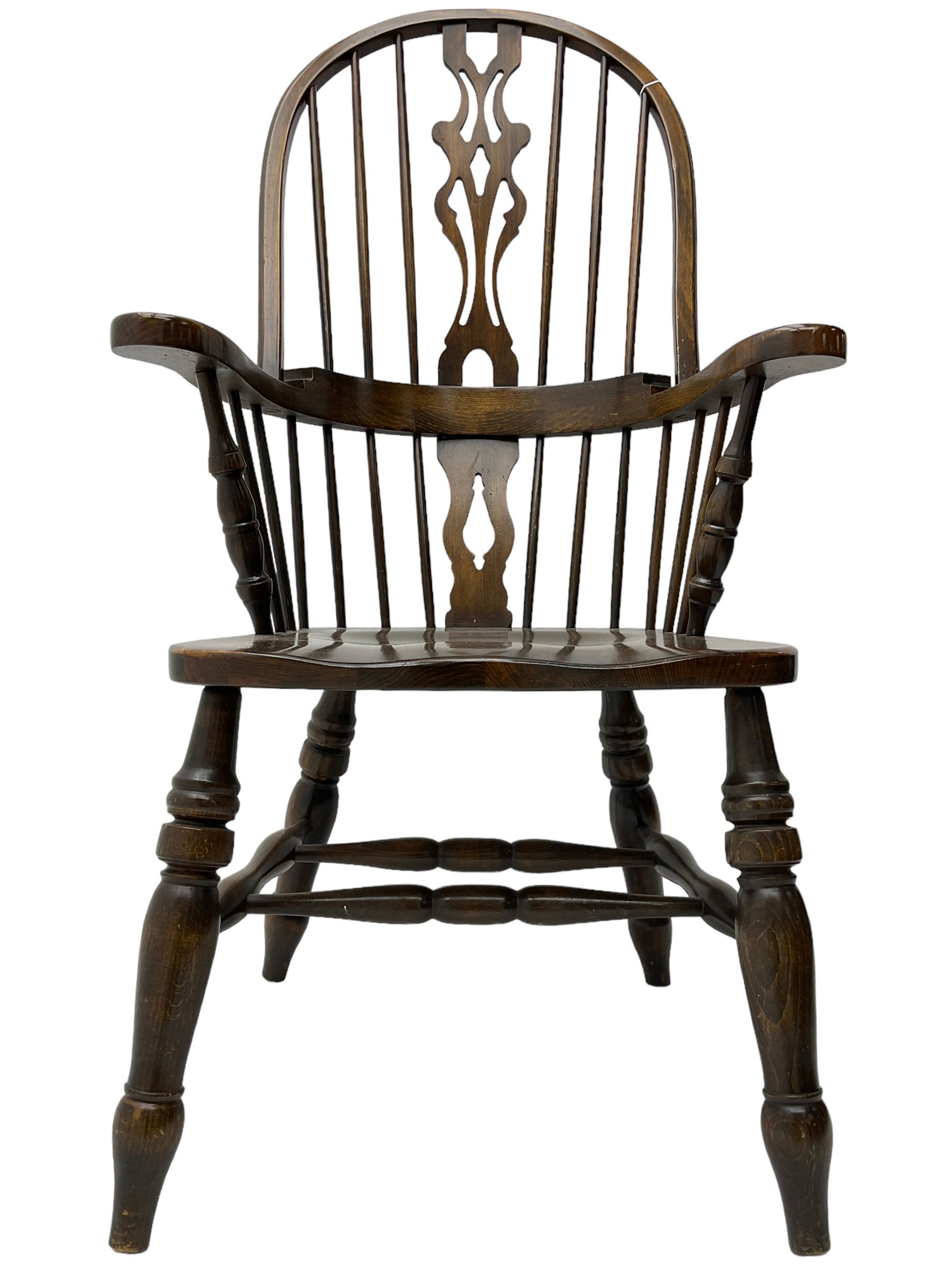 Stained beech Windsor armchair, double hoop and stick back with shaped and pieced splat back, on turned supports united by double swell-turned H stretchers