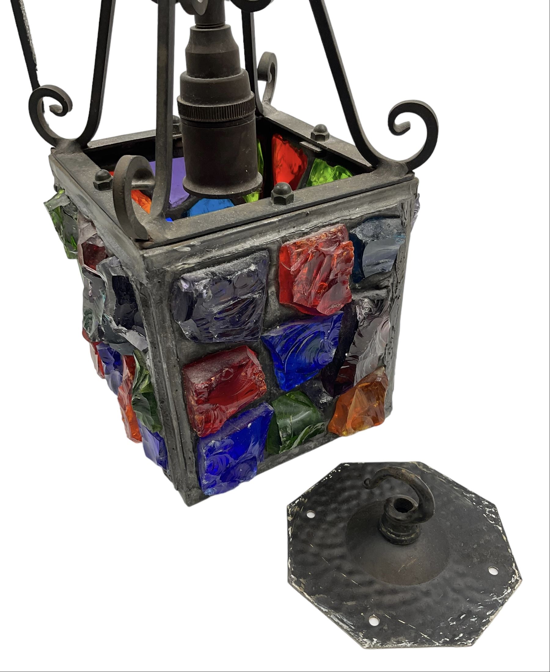 20th Century Peter Marsh Arts & Crafts wrought iron porch lantern, set with coloured panels, H36cm
