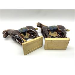 A pair of glazed pottery Tang style horses, each with impressed marks beneath, each approximately H25.5cm. 