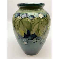 Moorcroft Grape and Leaf pattern baluster vase on green and blue ground, with impressed and painted mark beneath, H24cm