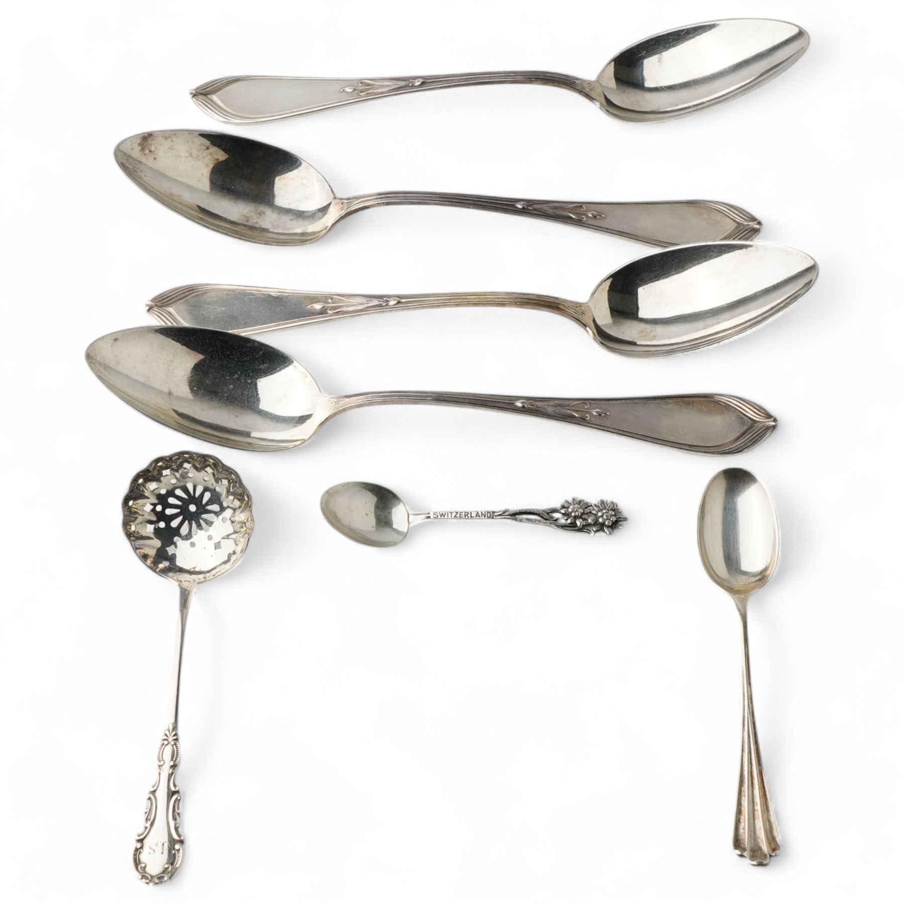Set of four German 800 standard silver table spoons with floral stems, sifting spoon, unmarked and two teaspoons