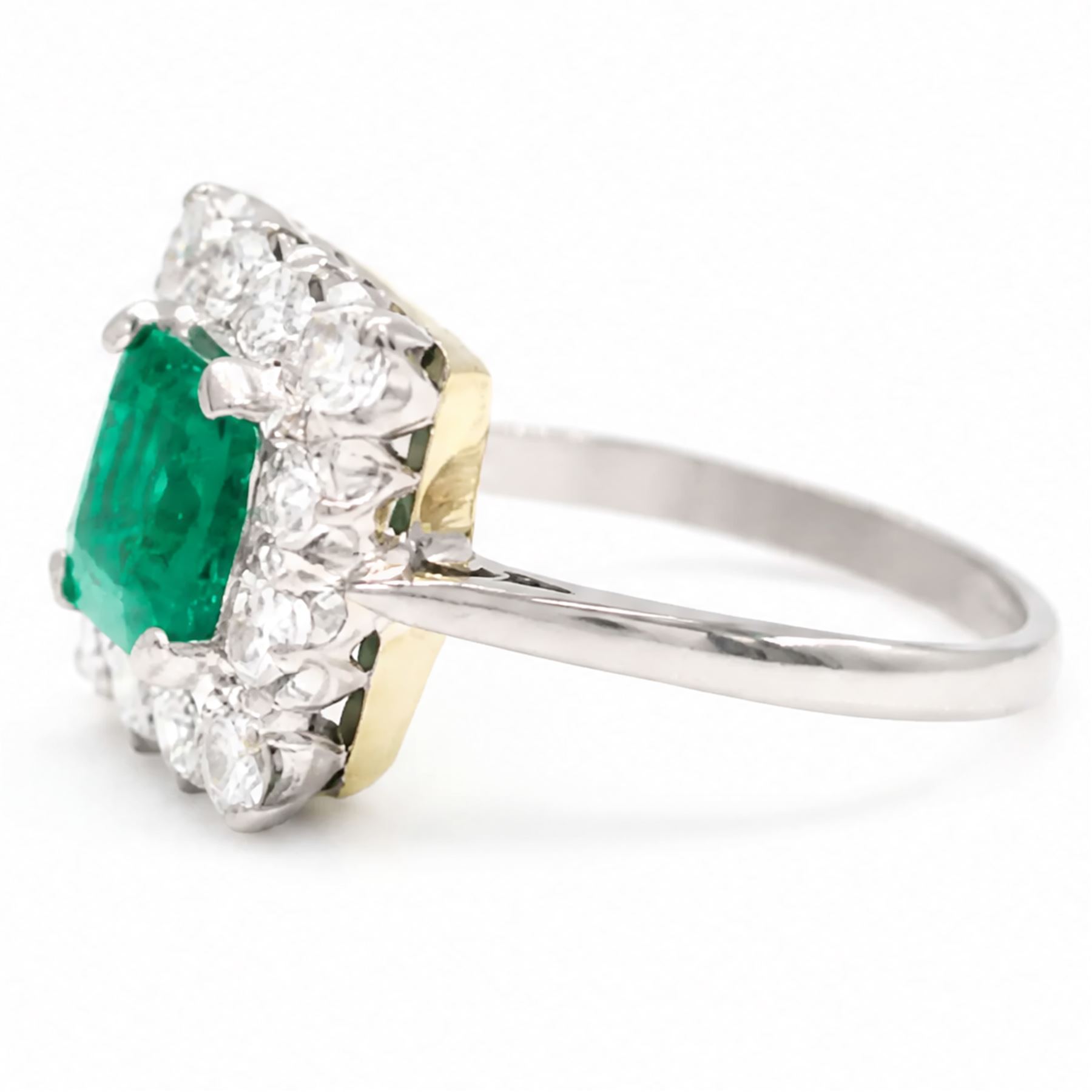 18ct white and yellow gold emerald and diamond cluster ring, single octagonal cut emerald of approx 1.55 carat, surrounded by twelve round brilliant cut diamonds, total diamond weight approx 0.95 carat