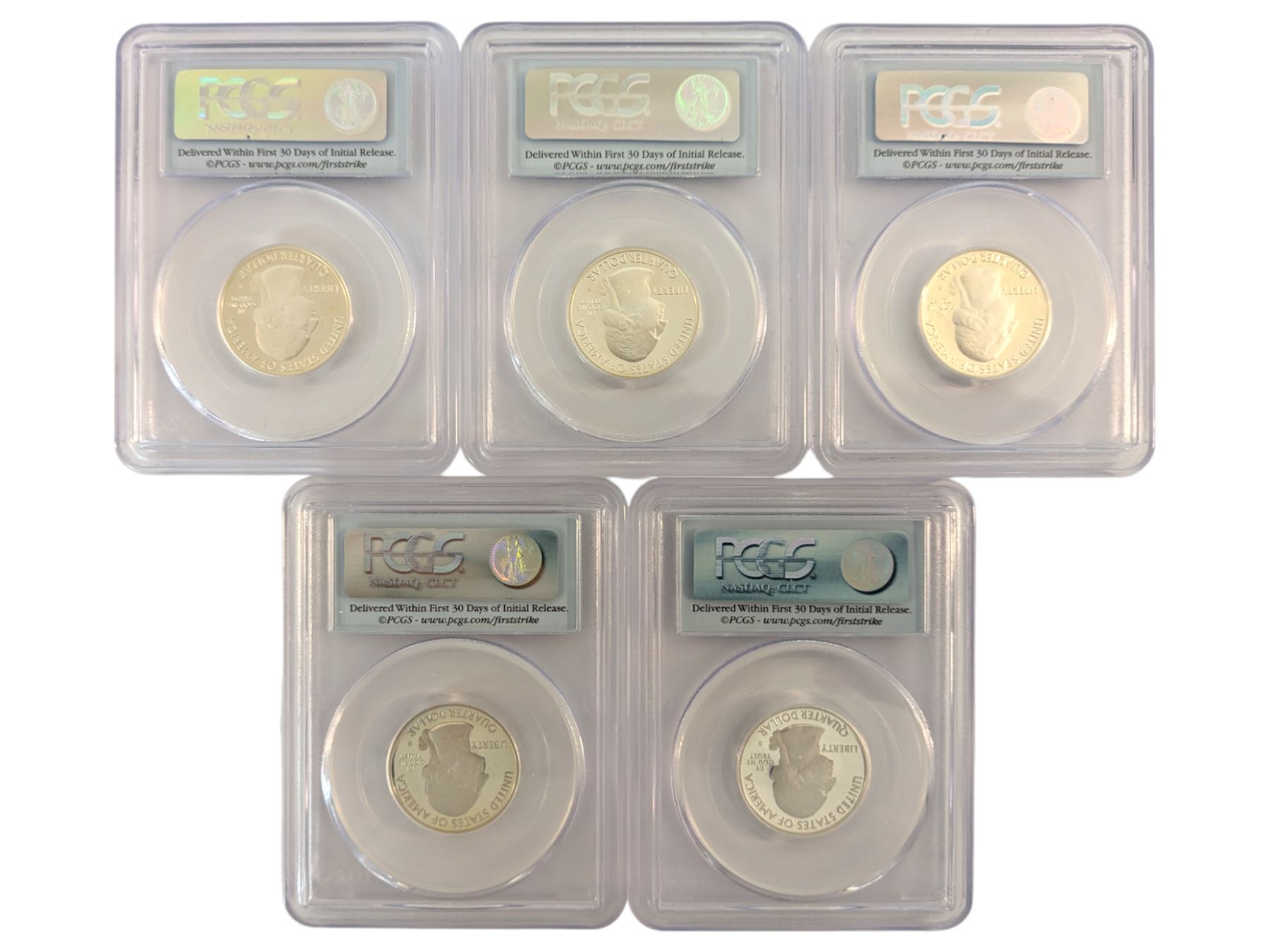 Five United States of America first strike silver twenty-five cent coins, each encapsulated and graded by PCGS