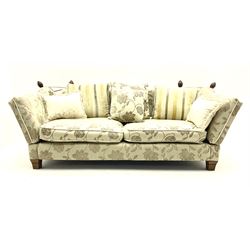 Grande Knole drop arm three seat sofa upholstered in pale fabric with raised floral pattern, with feather scatter cushions