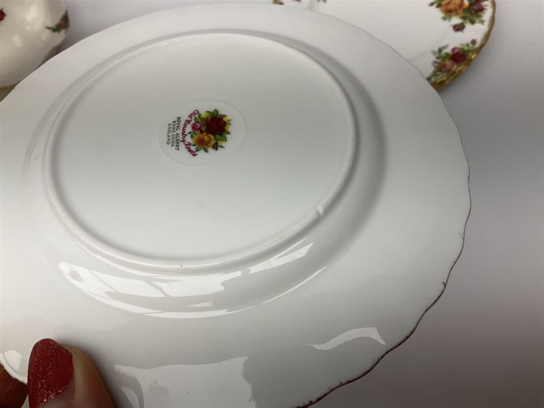 Royal Albert Old Country Roses pattern tea set, comprising teapot, coffee pot, six teacups and six saucers, five side plates, further teacup with joined saucer and side plate, open sucrier, milk jug, cake plate, and preserve pot and cover, together with Royal Albert Jubilee Rose pattern sauce boat and stand, and Royal Albert Lavender Rose pattern cake stand. 