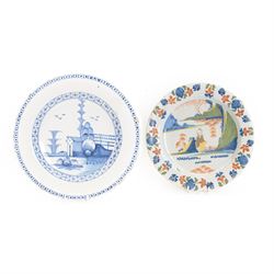 Mid 18th century Lambeth Delft plate, probably from the Abigail Griffith factory, circa 1750, painted in polychrome enamels with a figure seated in a landscape, within a garlanded border of flowers to rim, D34cm, together with a Liverpool Delft plate, circa 1760, painted in blue with a boathouse surrounded by trees by a river, within diaper and cell borders, D37cm