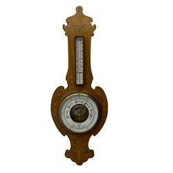 Edwardian art Nouveau aneroid barometer in a mahogany case inlaid with coloured satinwood scrollwork and motifs, with an open 8” porcelain dial displaying the silvered aneroid capsule and mechanism, with a brass recording hand and steel indicating hand recording barometric pressure from 26 to 32  inches, weather predictions in capitalised gothic script, within a flat glass and brass bezel, dial inscribed G F Smith & Co Scarborough” with a rectangular boxed mercury thermometer recording room temperature in degrees centigrade and Fahrenheit.